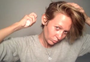 Woman following a scalp-first haircare routine to support healthier scalp conditions and fuller-looking hair